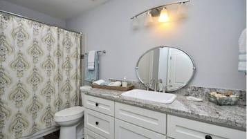 Bathtub, hair dryer, towels, soap