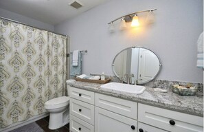Bathtub, hair dryer, towels, soap