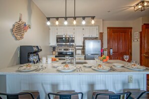 Enjoy cooking and dining in this well-equipped kitchen with a central island and appliances.