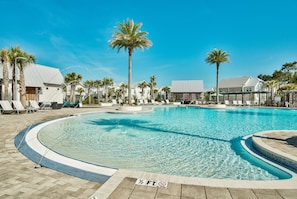 A swimming pool with lounge chairs and palm trees. - Crabbing Hole Lane - 5BR/4.5BA Prominence Home on 30A - Sleeps 12 - Golf Cart (Rosemary Bch)