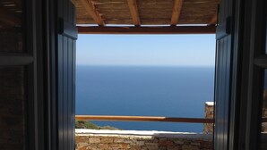An open doorway leading to a balcony with a view of the sea. - Blue Calm Luxury Cycladic Villa in Sifnos island  (Αρτεμώνας Sifnos)