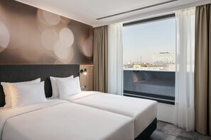 In-room safe, desk, laptop workspace, iron/ironing board - STAGES HOTEL Prague, a Tribute Portfolio Hotel (Prague)