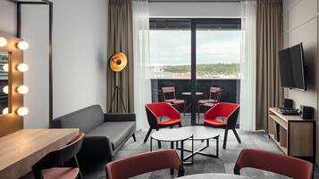 Family Suite, 2 Bedrooms, Balcony | Living room | 140-cm LCD TV with satellite channels, TV