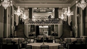 A grand hotel lobby with ornate chandeliers, a central staircase, and multiple dining areas. - Curia Palace Hotel Spa and Golf (Anadia)