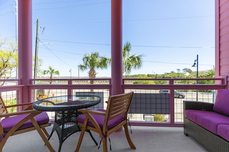 Outdoor dining. Boutique Hotel Folly Room 1: King Suite with large private balcony in the heart of Folly Beach