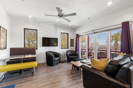 TV. Boutique Hotel Folly Room 1: King Suite with large private balcony in the heart of Folly Beach