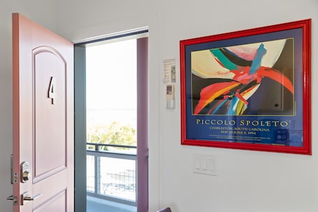 Interior. Boutique Hotel Folly Room 4: King Studio - cozy porch views of the Folly River