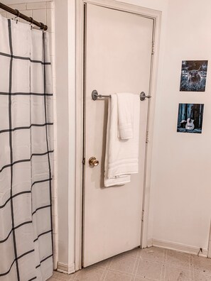Combined shower/tub, hair dryer, towels, soap