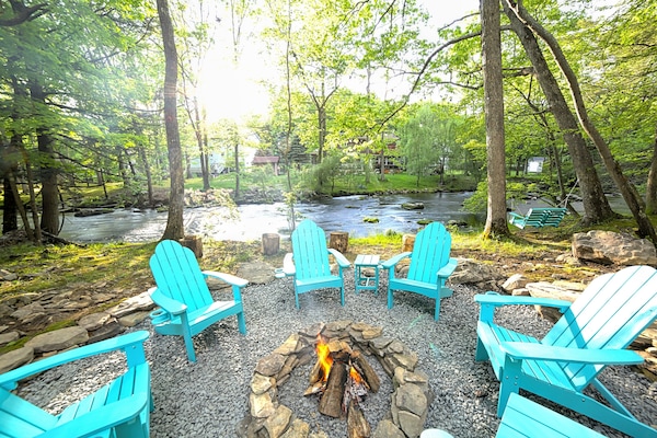 Welcome to the Poconos River House! Lounge streamside at the fire pit.