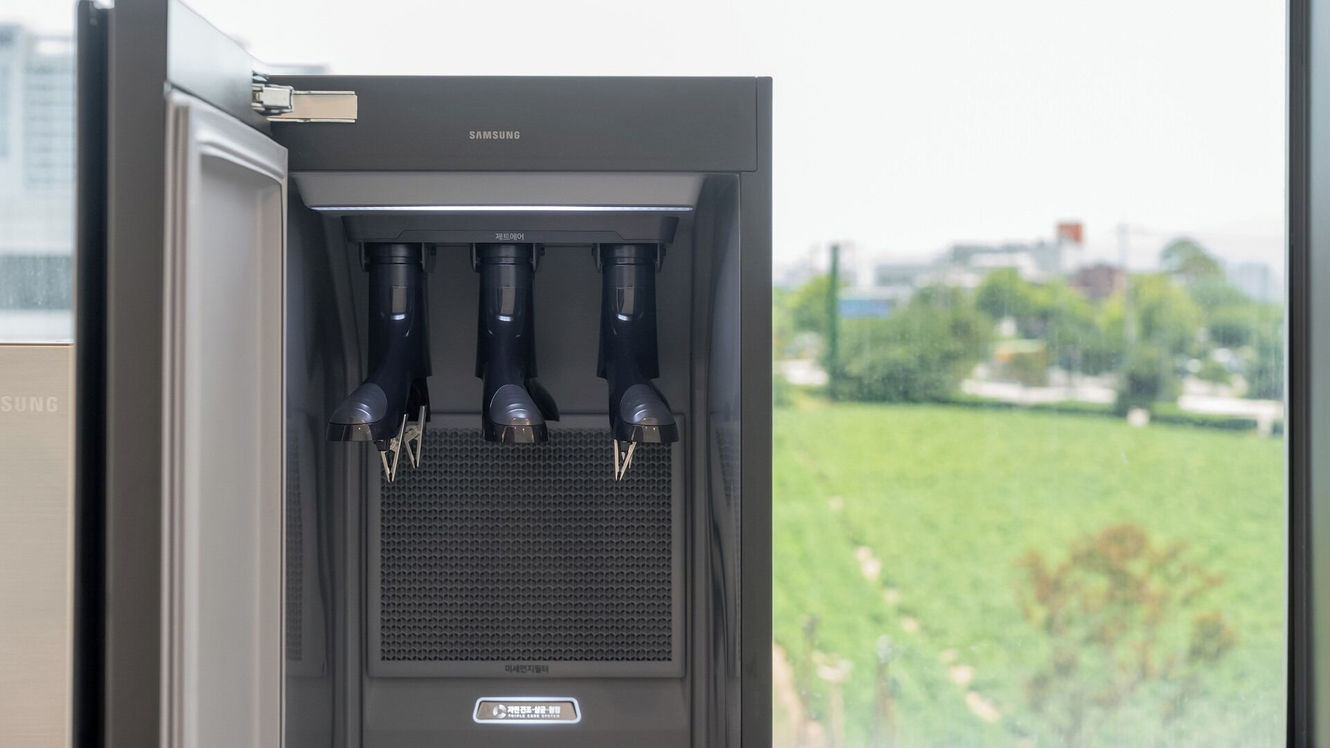 A Samsung air purifier with four filters, a control panel, and a vented front panel.