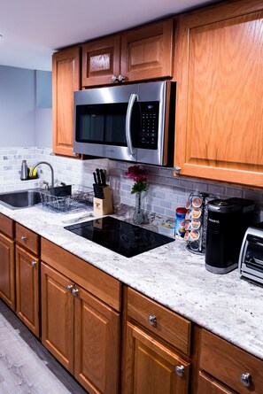 Fridge, microwave, stovetop, coffee/tea maker