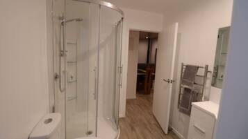 Shower, hair dryer, towels, soap