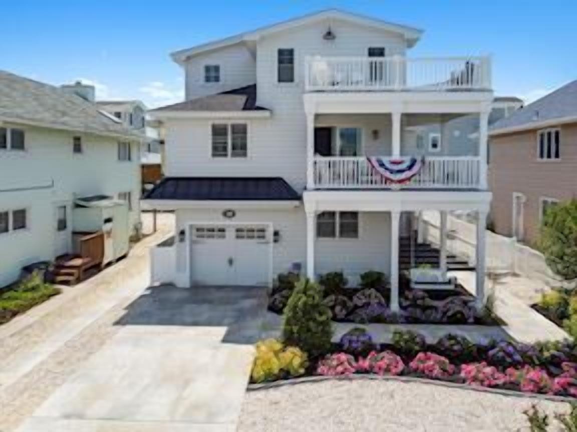 MAKE MEMORIES IN THIS NEWLY RENOVATED BEACH BLOCK HOME WITH HEATED POOL AND A ï¿½PEEKï¿½ OF THE ATLANTIC!