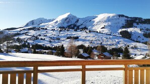 A snow-covered mountain landscape with a wooden deck in the foreground. - Contemporary chalet, panoramic view (ORMONT DESSOUS)