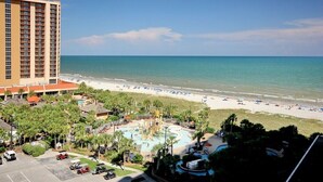 A resort with a pool area, beach, and a tall building. - Oceanviews-Steps 2 Beach-Stunning-MultiBalconies-Gated Community-Pool/Hottub (Myrtle Beach)