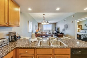 Condo, 2 Bedrooms, Balcony, Oceanfront (1702) | Private kitchen | Full-sized fridge, microwave, oven, stovetop - Sterling Breeze by Book That Condo (Panama City Beach)