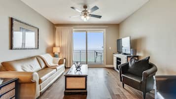 Condo, 2 Bedrooms, Balcony, Oceanfront (1702) | Living area | 32-inch flat-screen TV with cable channels, TV