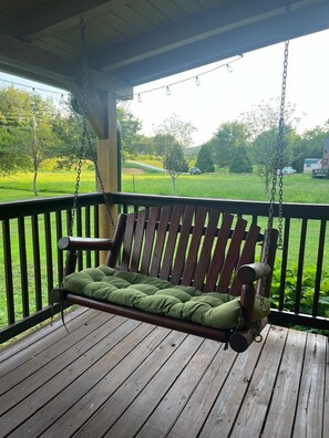 Relax on the porch with a comfortable swing, suspended from a sturdy beam.