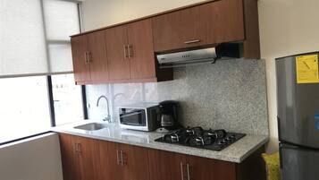 Fridge, microwave, stovetop, coffee/tea maker