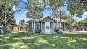 A log cabin with a number 324, surrounded by a well-maintained lawn and trees. - 5-Star Lux Modern Cabin in DT Fruita ❊ Dog Friendly❊ (Fruita)