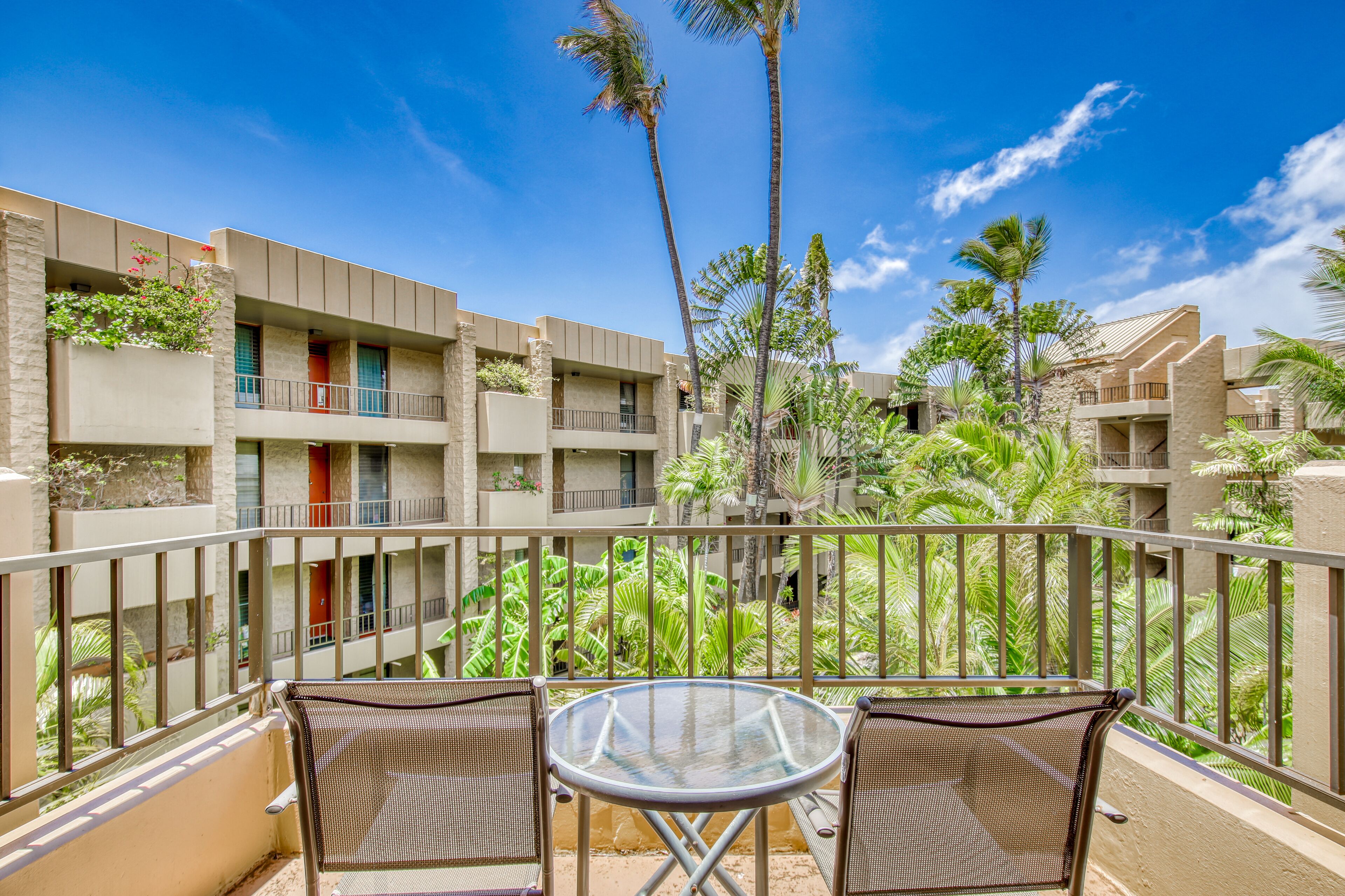 Fourth-floor condo with private balcony, hot tub, pool & W/D