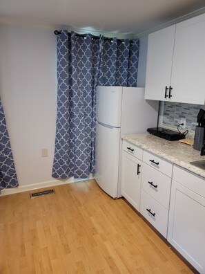 Fridge, microwave, coffee/tea maker, toaster