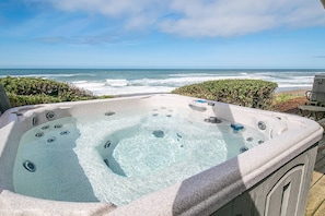 A hot tub with a view of the ocean.