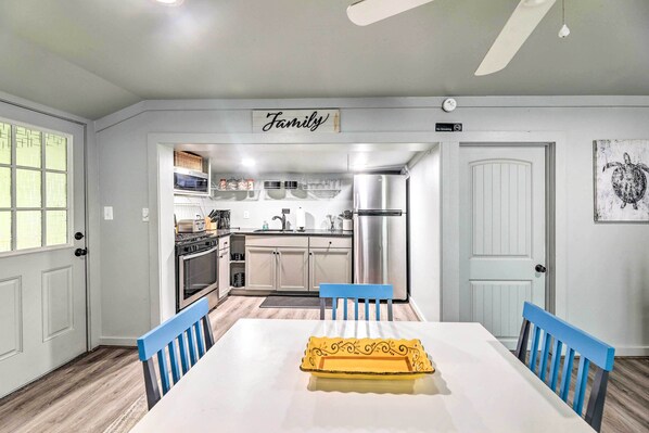 Enjoy meals together at the family kitchen with a central island and dining table for four.