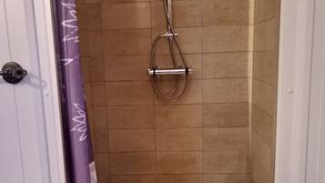 Bathtub, hair dryer, towels, soap