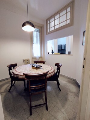 Enjoy meals in this cozy dining area with a round table and comfortable seating for four.