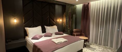 Premium bedding, memory foam beds, minibar, desk