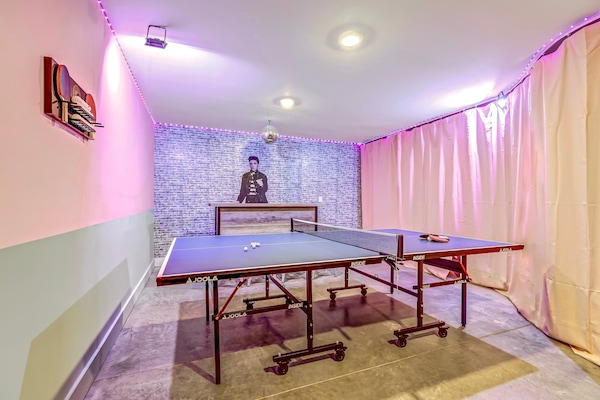 Welcome to your chic game room oasis, perfect for competitions and laughter. Ideal for bachelorette parties or family reunions, enjoy stylish decor and vibrant vibes while challenging friends to ping pong in this Nashville getaway!