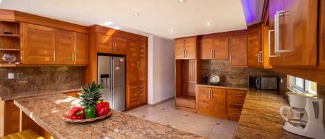 Fridge, cookware/dishes/utensils, dining tables