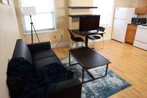 Apartment (2 Bedrooms) | Living room | TV - Close to Campus Student Housing - Amenities (St. Louis)
