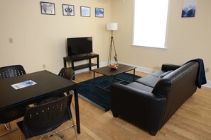 Apartment (2 Bedrooms) | Living room | TV - University Retreat With Plenty of Restaurants Nearby (St. Louis)