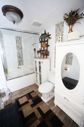 Bathtub, hair dryer, towels, soap
