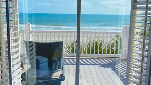A balcony with a view of the ocean, a chair, and a railing. - ☆Oceanfront Serenity☆ Private Pool & Beach Walkway (Myrtle Beach)
