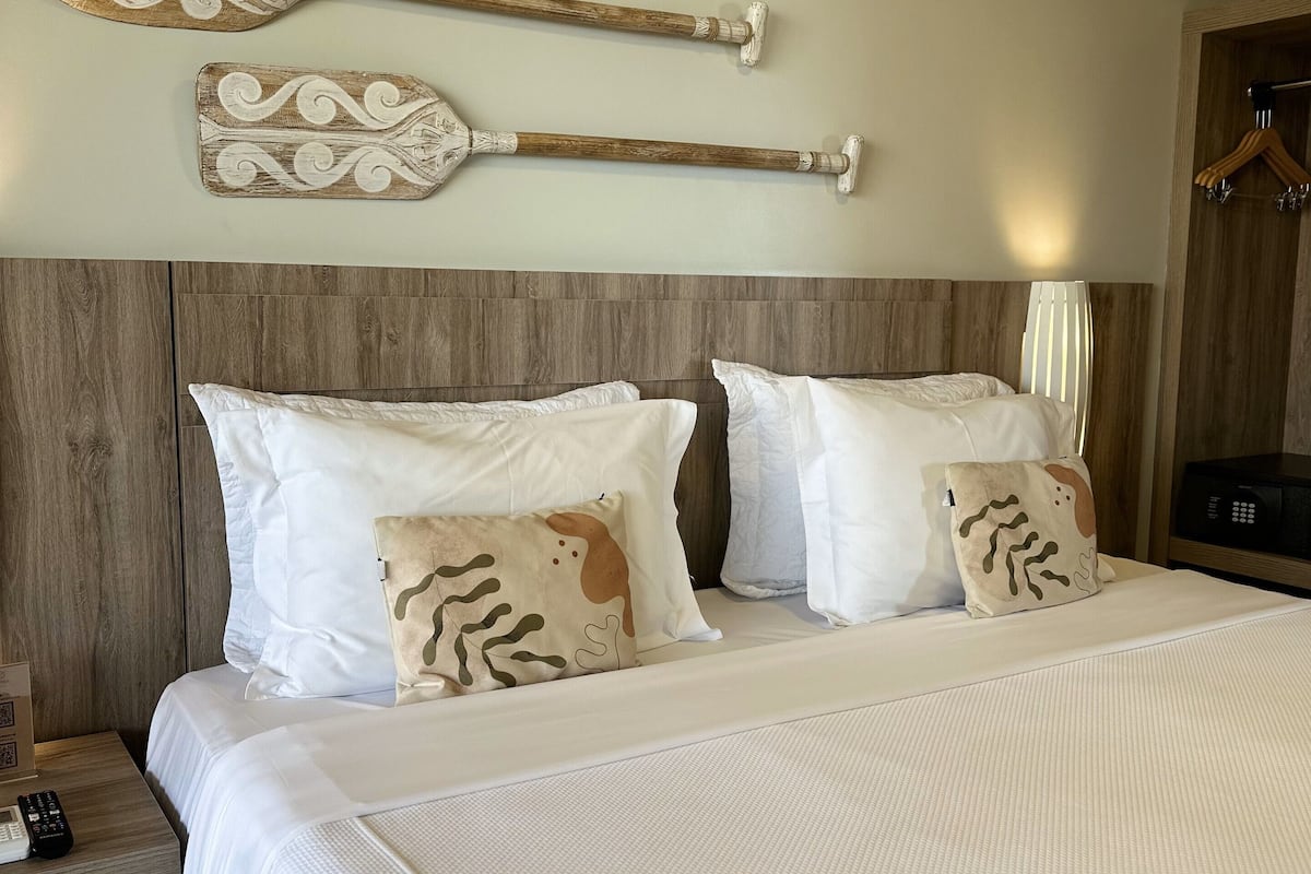 premium suite, beach view | 1 bedroom, minibar, in-room safe, individually decorated