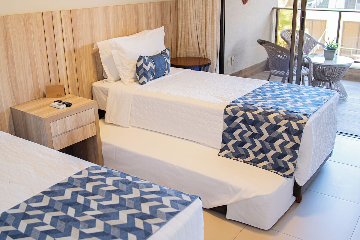 family room | 1 bedroom, minibar, in-room safe, individually decorated