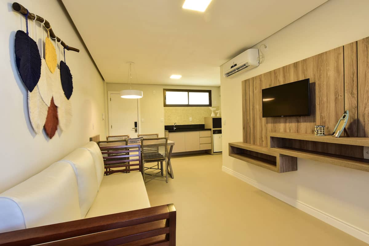 deluxe suite, 1 bedroom, ensuite, garden view | living area | 32-inch smart tv with satellite channels, tv