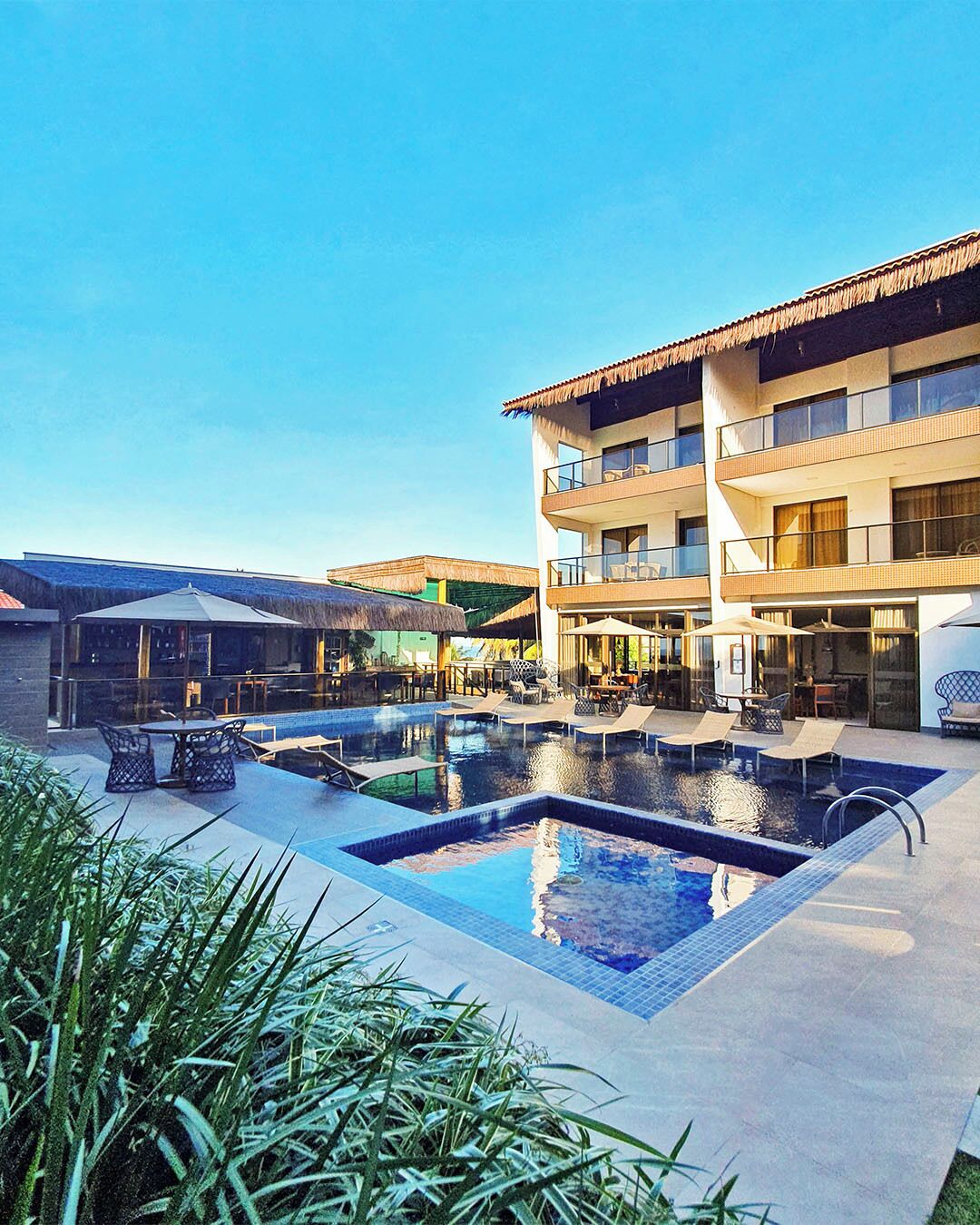 outdoor pool, pool umbrellas, pool loungers