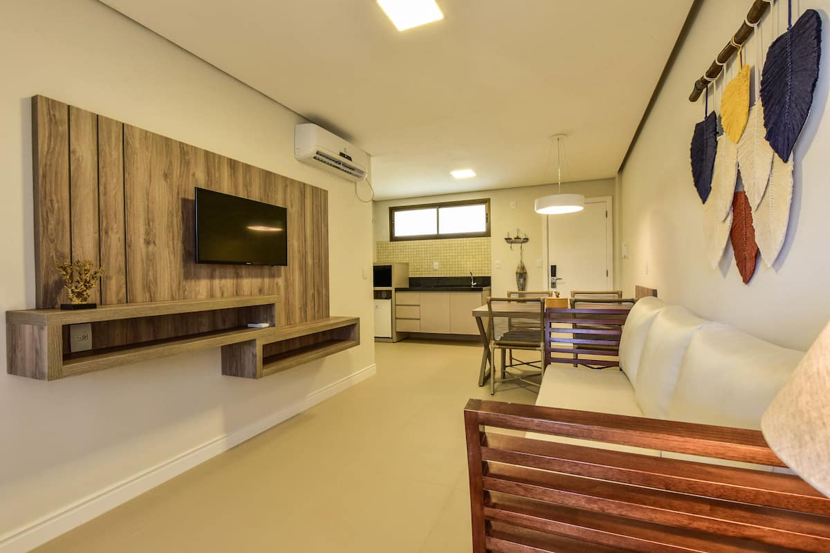 deluxe suite, 1 bedroom, ensuite, garden view | living area | 32-inch smart tv with satellite channels, tv