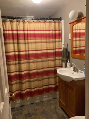 Combined shower/bathtub, towels, soap