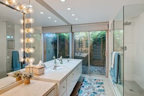 Shower, hair dryer, towels, toilet paper
