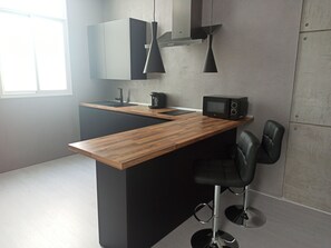 Fridge, microwave, stovetop, coffee/tea maker