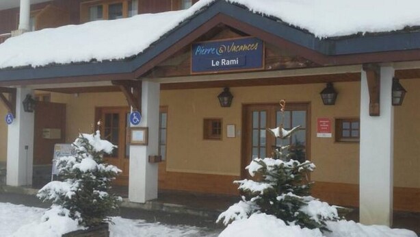A building with a sign reading "Pierre Vacances Le Rami". - Apartment at the foot of the slopes in a typical village of our mountains (Les Coches, La Plagne-Tarentaise, France)