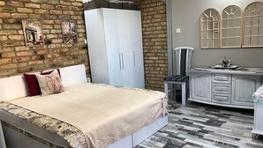A bedroom with a bed, a wardrobe, a desk, and a chair. - Very nice luxury apartament (Varna)