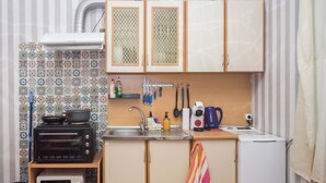 A compact kitchen with a microwave, toaster, and kettle. - DOWNTOWN - Compact Flat  - 2 Separate Rooms (Бургас)
