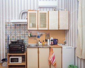 Fridge, microwave, electric kettle, dining tables