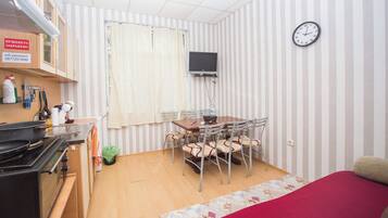 Fridge, microwave, electric kettle, dining tables